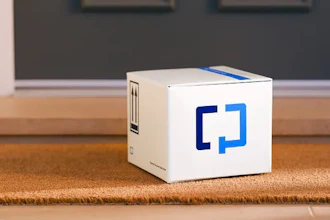 White Zapier product box with blue logo on wooden floor in modern interior
