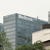 Medtronic corporate office building with white signage on gray facade, surrounded by modern architecture