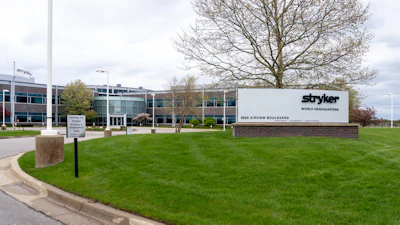Stryker World Headquarters building entrance with corporate signage on manicured lawn
