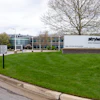 Stryker World Headquarters building entrance with corporate signage on manicured lawn