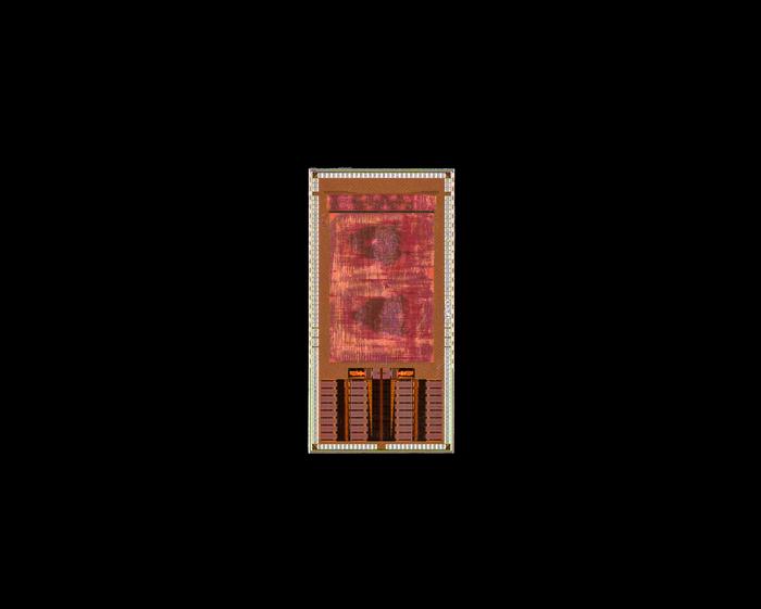 Red and gold circuit board design with geometric patterns and component layout