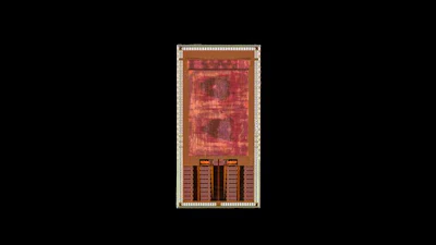 Red and gold circuit board design with geometric patterns and component layout