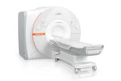 Siemens MAGNETOM medical imaging scanner with white casing and orange accent stripe