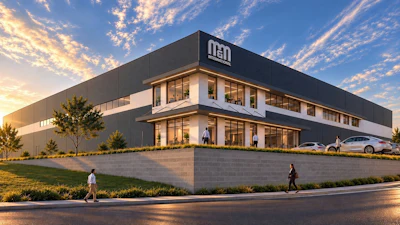 Modern NED corporate facility at golden hour with landscaping and parking area