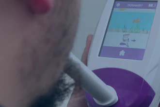 Person holding white handheld medical diagnostic device with purple accents and touchscreen display