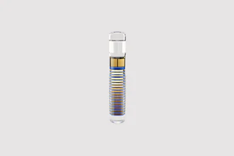 Cylindrical water filter cartridge with blue and gold striped design and clear housing