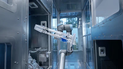 Interior view of robotic medical device with mechanical arm, tubing, and electronic components