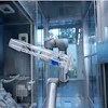 Interior view of robotic medical device with mechanical arm, tubing, and electronic components